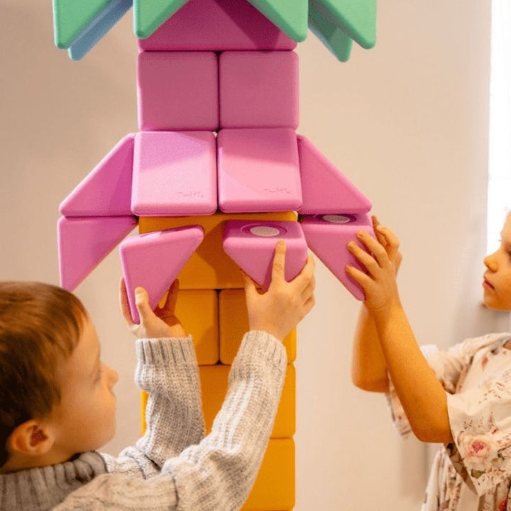 Two children building together with TUKI Big Magnetic Foam Blocks Smart 340, demonstrating collaborative sensory play and social communication development