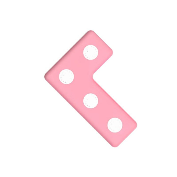 TUKI Regular Magnetic Foam Block pink L-shape from the 26-element neodymium magnetic construction set, showing the closed-cell foam construction and rotating magnet capsule design