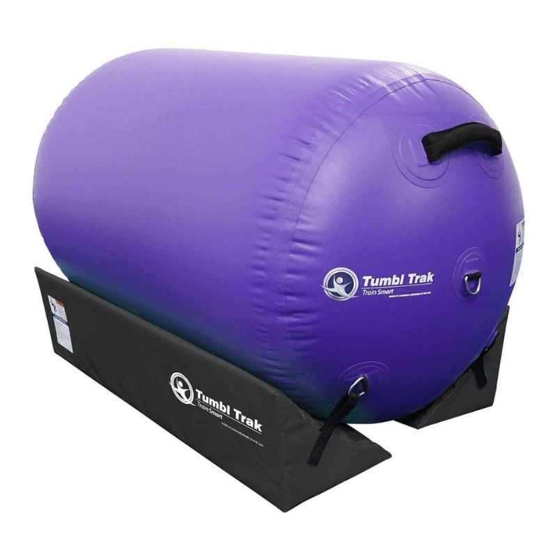 Close-up view of the Tumbl Trak Air Barrel in Purple showing the high-quality vinyl construction, D-ring attachment points, and handle detail used for portable inflatable gymnastics training