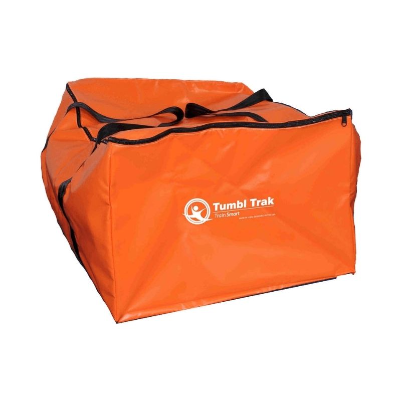 Tumbl Trak Air Floor PRO with the included carrying bag showing the deflated and rolled storage configuration, demonstrating the portable inflatable gymnastics air track's compact storage and transport capability