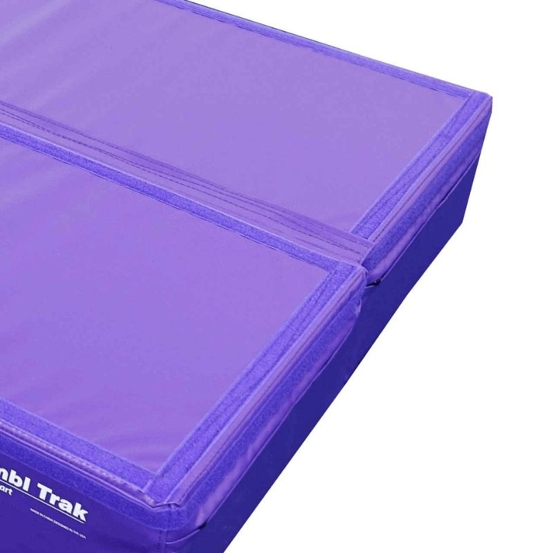 Edge-on view of the Tumbl Trak Booster Block showing the 8-inch height profile and 18 oz. knife-coated vinyl covering over the firm polyurethane foam core rated to 200 lbs for gymnastics and plyometric training