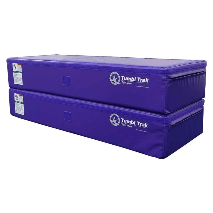 Two Tumbl Trak Booster Blocks in Purple stacked using the loop and hook Velcro connection system, demonstrating the 16-inch stacked height configuration for gymnastics spotting and training stations