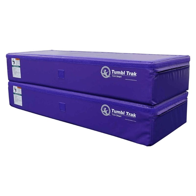 Two Tumbl Trak Booster Blocks in Purple stacked using the loop and hook Velcro connection system, demonstrating the 16-inch stacked height configuration for gymnastics spotting and training stations