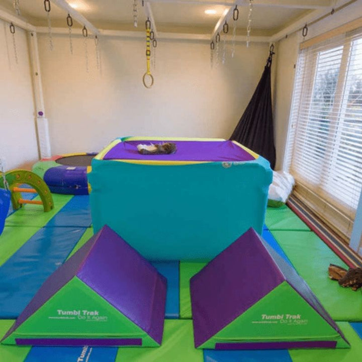 Tumbl Trak Boundex Cuddle Box in a therapy room setting showing the full footprint of the sensory lycra equipment in a home or clinic environment
