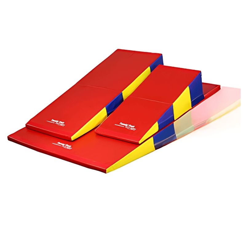 Tumbl Trak Folding Incline Mat in Primary Rainbow showing the wedge mat profile and vinyl cover detail, designed for gymnastics skill development and vestibular sensory play