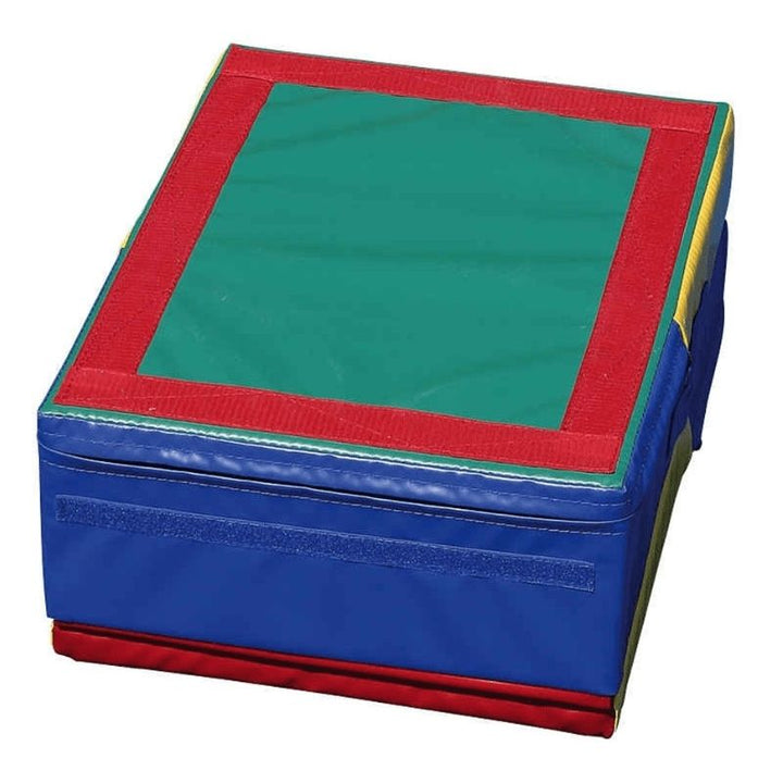 Tumbl Trak Folding Mini Ramp folded into a stable block with Velcro flap secured, showing the compact block shape used for jumping, standing, and cartwheel obstacle activities