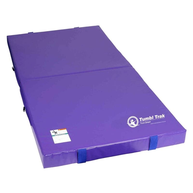 Tumbl Trak Jr. Practice Mat in Purple showing the full 3ft x 6ft x 4in compact gymnastics crash mat landscape view, a dual-density open-cell foam landing mat for home training spaces, bedroom gymnastics, and small gym stations