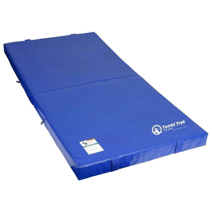 Tumbl Trak Jr. Practice Mat in Royal Blue showing the full landscape view of the compact 3-foot by 6-foot gymnastics landing mat with 18 oz. knife-coated vinyl and dual-density foam for home gymnastics and recreational play