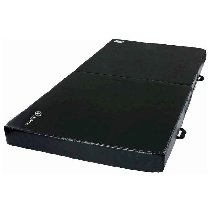 Tumbl Trak Practice Mats in Black second landscape view showing the gymnastics landing mat folded into block shape, demonstrating the fold-in-half Smart Mat Technology feature for drill progressions and compact storage