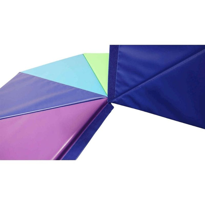Tumbl Trak Rainbow Pizza Mat showing the deeper rainbow colour variants of the eight foam wedge segments, demonstrating the high-contrast colour design used for colour recognition activities and structured gymnastics movement games