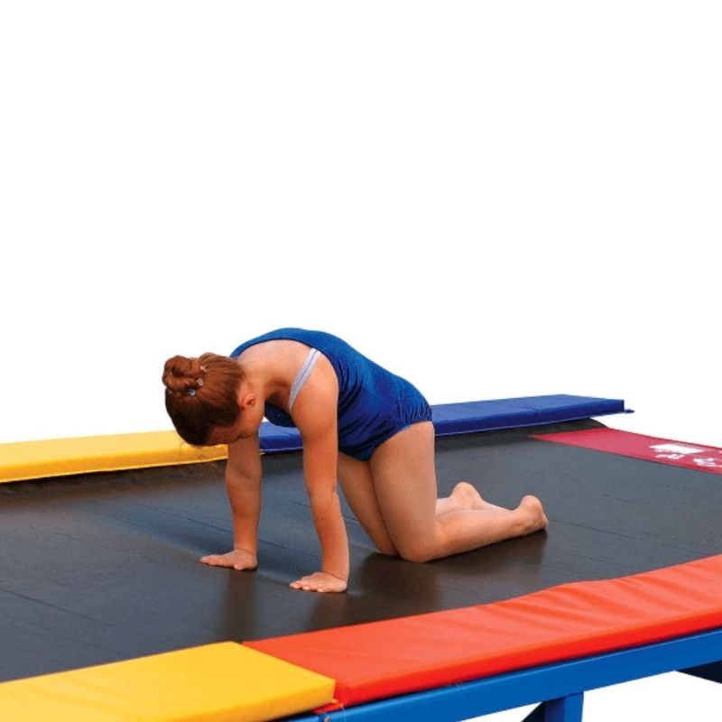 Girl in active use on the Tumbl Trak Recreational Tumbling Track showing the forgiving bounce of the 6-inch mini-trampoline springs ideal for beginner skill development and vestibular motor play