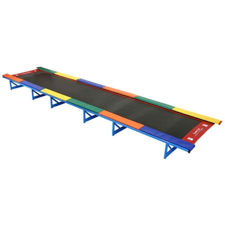 Tumbl Trak Recreational Tumbling Track full landscape view showing the soft mini-trampoline spring bed, multi-colour side pads, and heavy-duty powder-coated steel frame for preschool and beginner gymnastics programmes