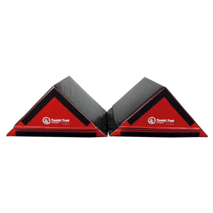 Tumbl Trak Slanted Ninja Steps pair in default double triangle configuration showing the 17-inch height and 33x24-inch base, firm crosslink foam construction, and hook Velcro base for carpet bonded foam attachment