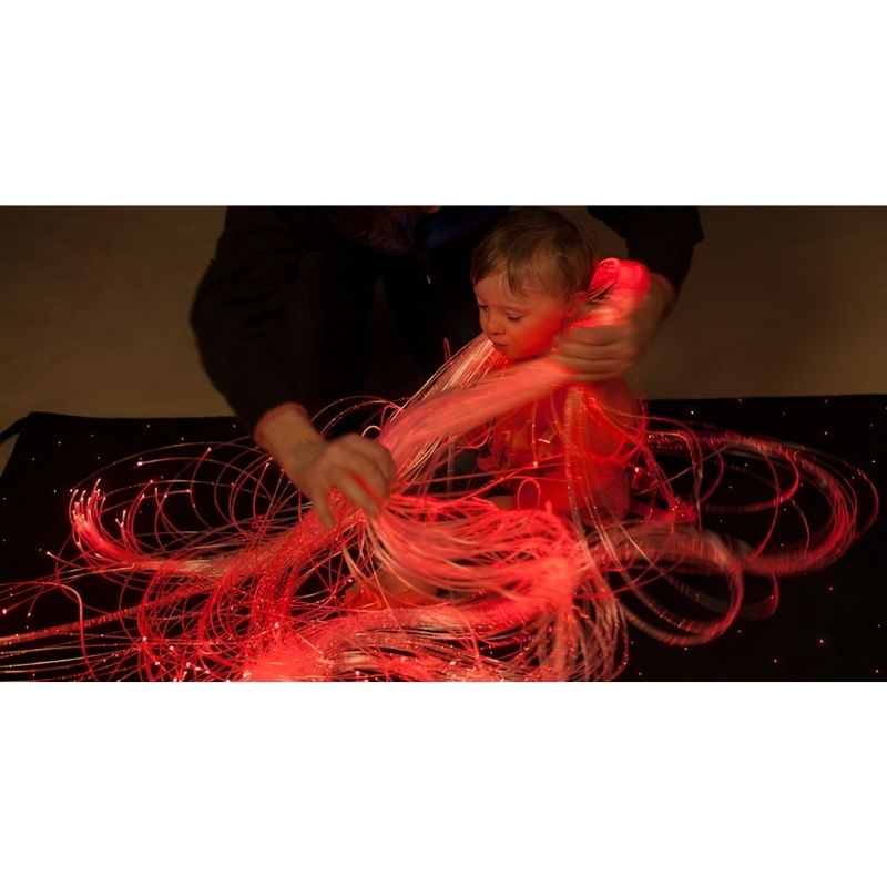 UFO fibre optic spray harness tail detail showing durable polymer construction for safe tactile exploration in therapy and home sensory spaces