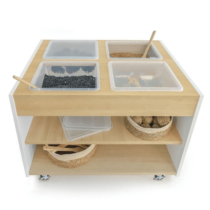 Whitney Brothers elevatED Mobile Sensory Table front view with containers and baskets on the two open fixed storage shelves, showing the full 34" wide sensory table with lockable casters