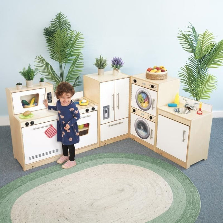 Whitney Brothers Contemporary Kitchen Ensemble Natural child playing view showing the natural birch plywood finish of the five-piece classroom play kitchen set