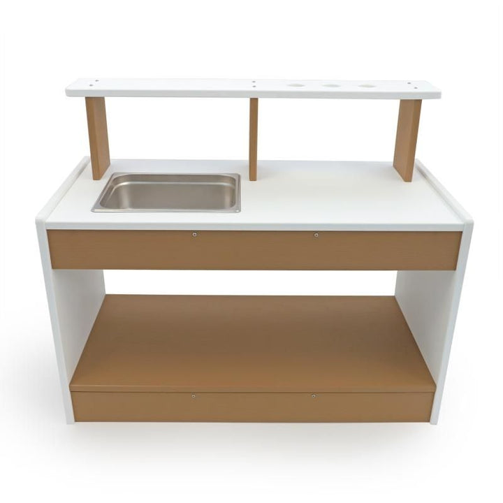 Whitney Brothers outdoorED Mud Kitchen clean front view showing textured woodgrain maple and polar white HDPE construction with utensil shelf and lower open storage