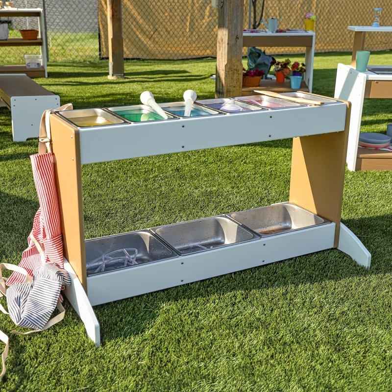 Whitney Brothers outdoorED outdoor STEM play station landscape view showing full weatherproof HDPE profile with nine stainless steel trays for outdoor preschool science and sensory play