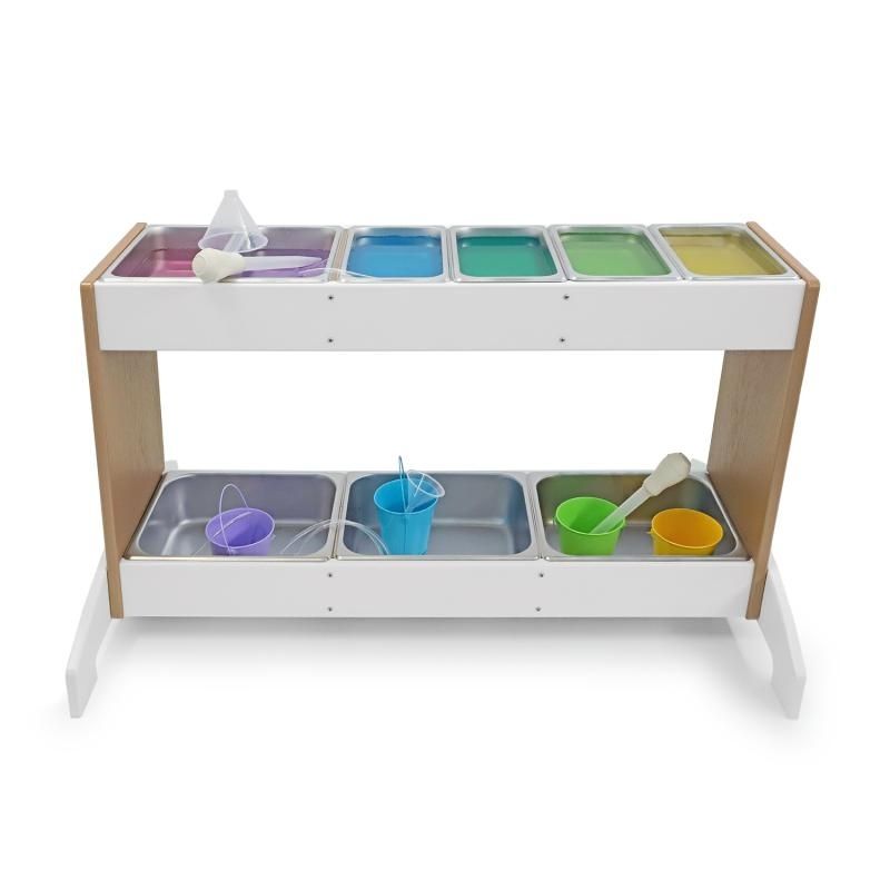 Whitney Brothers outdoorED Potion Station portrait view with coloured materials in stainless steel trays, showing outdoor STEM sensory play station in active preschool use