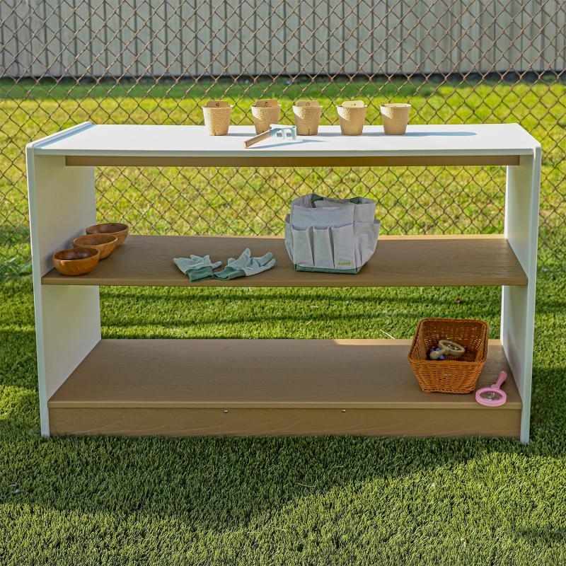 Whitney Brothers outdoorED Storage Shelf front view showing three levels of open outdoor classroom storage with textured woodgrain maple and polar white HDPE finish