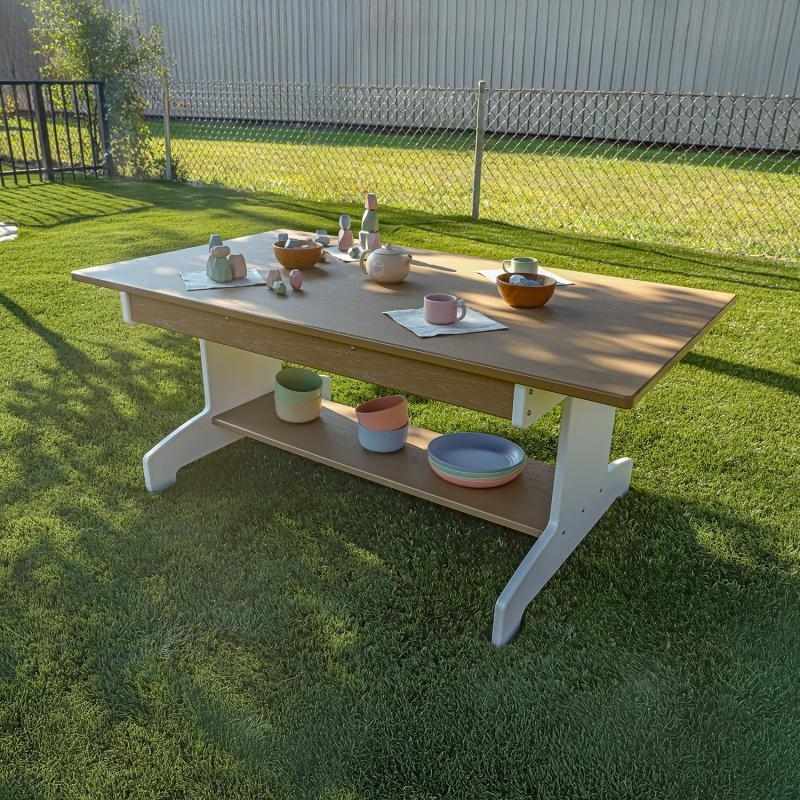 Whitney Brothers outdoorED Classroom Table landscape view in outdoor learning setting showing weatherproof HDPE construction and full-length lower storage shelf