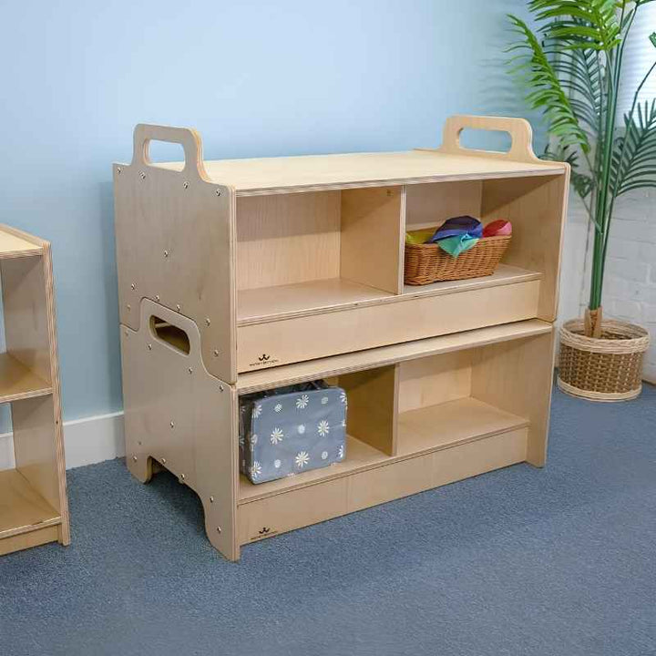 Whitney Brothers Stack-Able Benches stacked as a two-sided storage cabinet in an early learning classroom setting, showing how two units interlock to organise classroom materials and define flexible learning zones