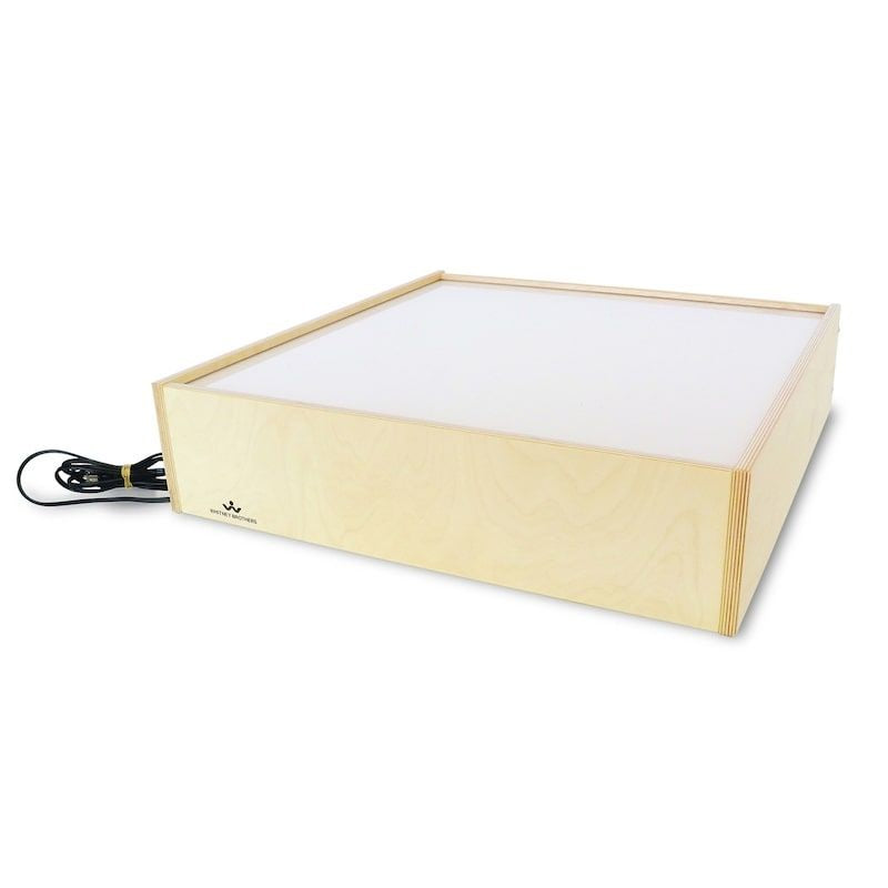 Clean product view of the Whitney Brothers Superbright LED Tabletop Light Box WB0717 showing the compact 24.5" wide birch plywood construction and low 6" profile for placement on any surface