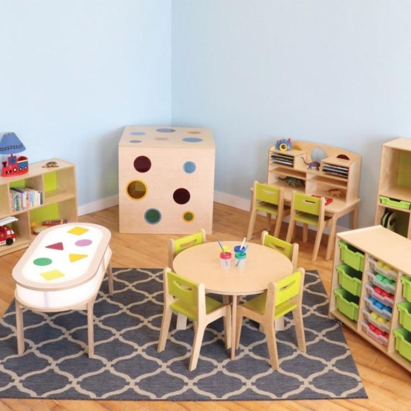 Whitney Brothers Whitney Plus Radiant LED Light Table in an activity room setting, showing the illuminated side panels and curved corners of the collaborative sensory light table