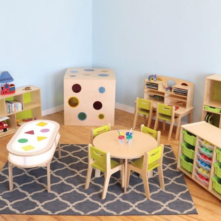Whitney Brothers Whitney Plus Radiant LED Light Table in an activity room setting, showing the illuminated side panels and curved corners of the collaborative sensory light table