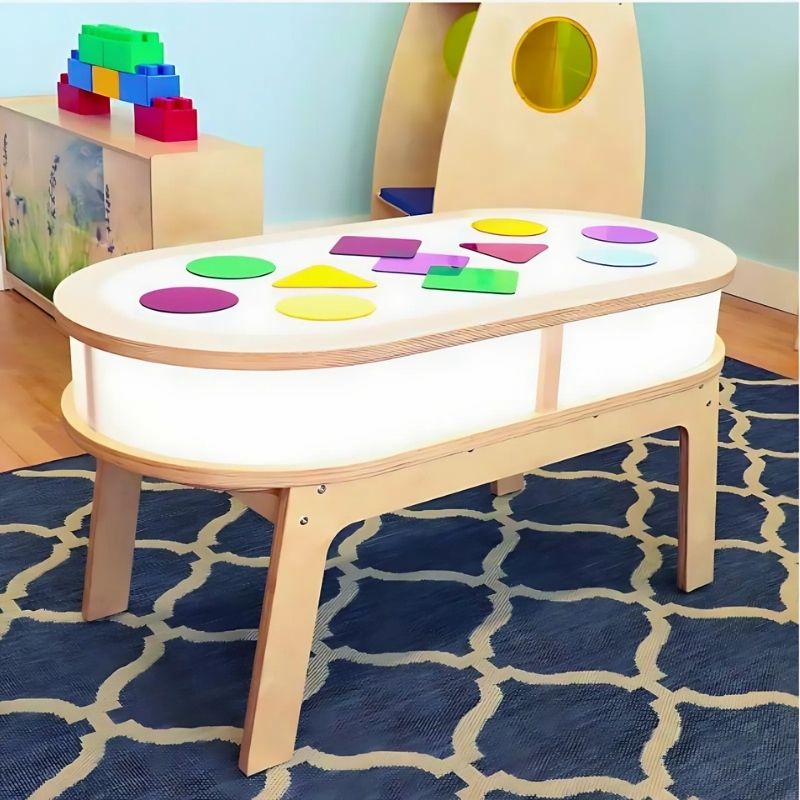 Whitney Brothers Whitney Plus Radiant LED Light Table portrait view showing the full elongated 47" curved-corner table with illuminated side panels from the Whitney Plus Collection