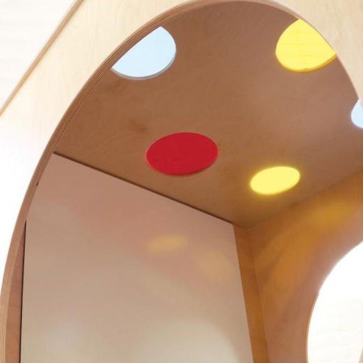 Interior view of the Whitney Brothers Whitney Plus Porthole Play House Cube showing the non-ghosting dry-erase marker board and tray mounted on the back wall of the private play space