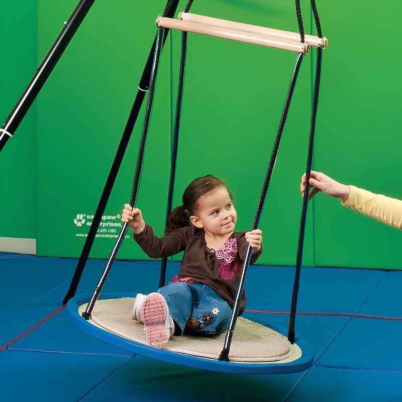 Child engaging with the Southpaw Itinerant Platform Swing during a vestibular sensory integration therapy session